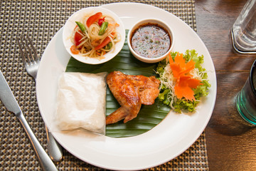 Green papaya salad, grilled chicken and sticky rice