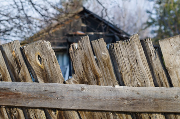 Old shabby wooden fence. Rural abstract backgrounds