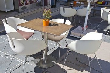 Table with chairs in outdoors cafe