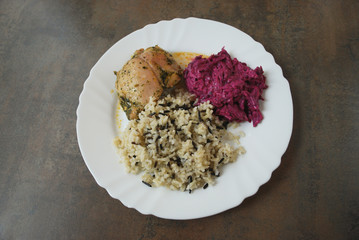 Chicken with wild and white rice and beetroot salad. The finished dish.