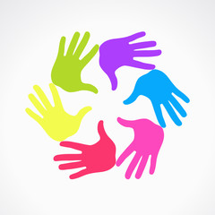 Conceptual circle of colorful hand prints