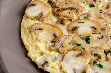 Delicious omelet with mushrooms and tomatoes