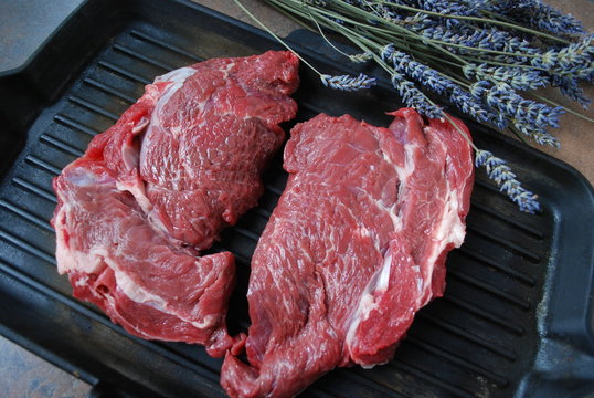 Fresh beef steak on a grill.