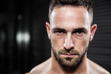 Portrait of shirtless man looking at the camera