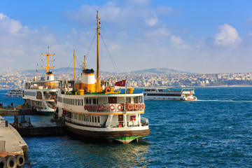 Istanbul's water transport with nostalgic Turkish steamboat - passenger ship - in Karakoy Pier as travel concept of Istanbul,Turkey