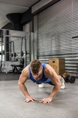 Fototapeta premium Muscular man doing push up