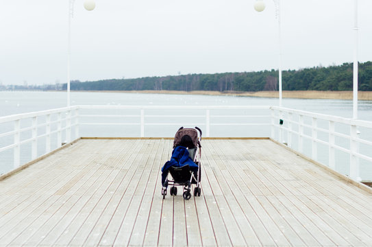 Empty Stroller On A Pier