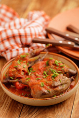 Quail under tomato sauce
