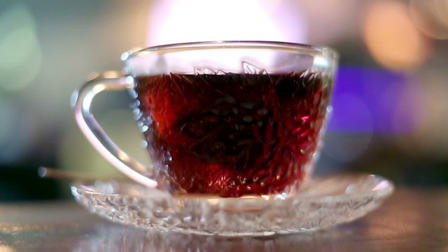 Black tea brewed with hot water in a glass cup