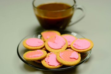 Coffee and Pink Cookie Cream Filling on glass table