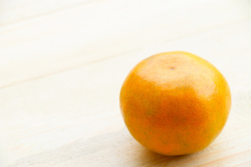 Orange fruit on wooden table background for healthy.