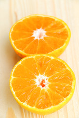 Naklejka na ściany i meble Orange fruit on wooden table background for healthy.