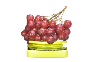 bunch red seedless crimson grape on electronic kitchen scale