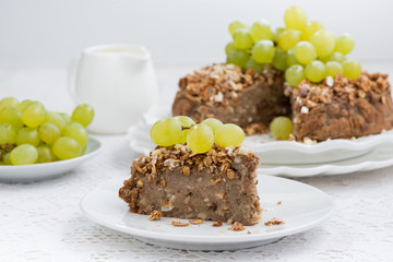 piece of nut pie with grapes