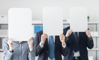 Business people holding a white sign