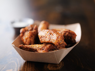 bbq chicken wings in paper tray