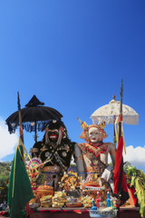 Barong Landung traditional protective spirit of Bali in human body at ceremony Melasti before Balinese New Year and silence day Nyepi. Holidays, festivals, rituals, art, culture of Indonesian people.