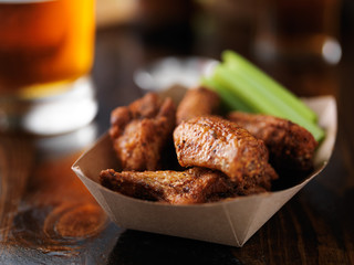 bbq chicken wing basket shot with extreme selective focus