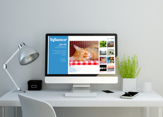 modern clean workspace with influencer website on screen