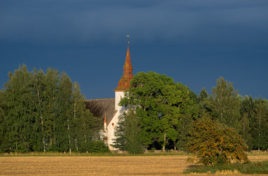 Mary's Church, grain field, blue sky and natural environment. Torma in the summer, small village in Estonia. Europe