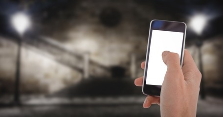 Composite image of cropped hand of man using mobile phone