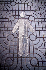 sign of man on sidewalk is mean way for walking