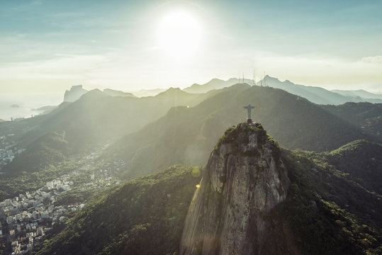 Rio de Janeiro, Brazil : Aerial view of Christ and mountains at sunset