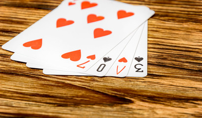 The word "love" spelled with playing cards