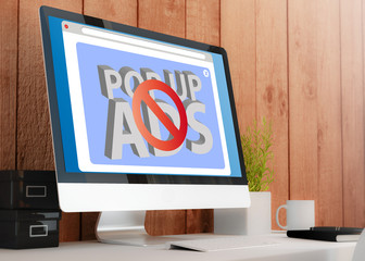 modern workspace with computer showing ads blocker