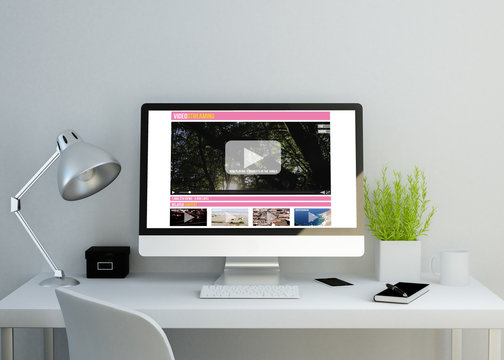 modern clean workspace with videostreaming website on screen