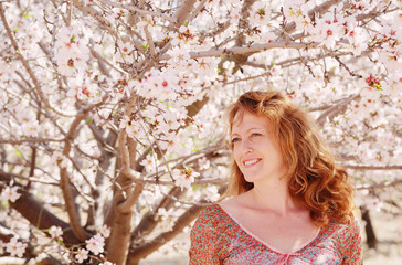 Spring portrait of beautiful 40 years old woman outdoors