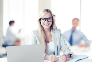 businesswoman with documents in office