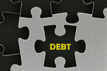 The black jigsaw puzzle  written word debt