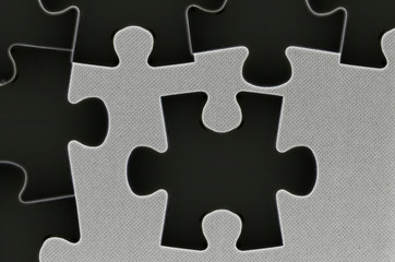Black empty jigsaw puzzle with copy space area