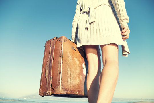 adventurous woman traveling with her suitcase