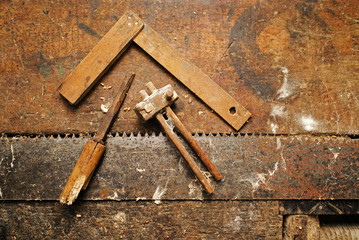 old two-handed saw and diferent woodworking tools