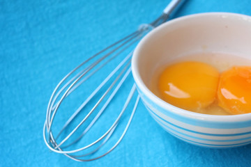 Eggs in a bowl with whisk