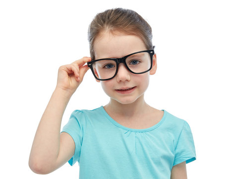 happy little girl in eyeglasses