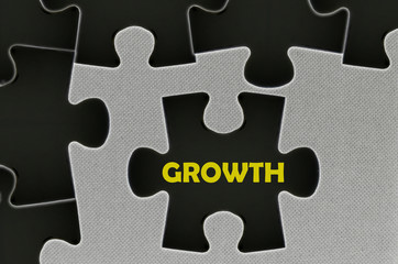 Fototapeta premium The white jigsaw puzzle written word growth