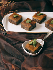 Chocolate  brownie on the dark vintage table. 