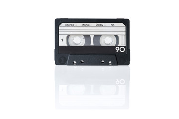 An isolated black audio cassette on a white background