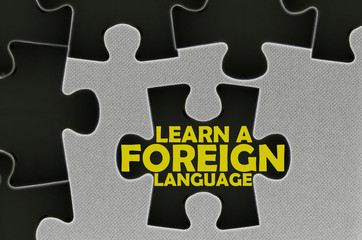 Fototapeta premium jigsaw puzzle written word learn a foreign language
