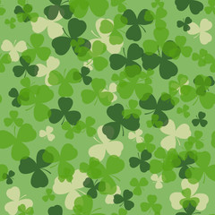 Vector St Patrick's day seamless pattern. Green and white clover leaves on green background. Irish design for card, invitation or greeting, textile, website, brochures and booklets