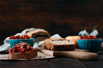 Homemade integral bread and vitamin salad on the rustic table. 
