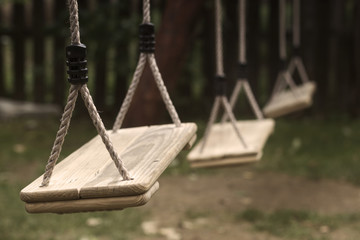 Empty children swings in the park