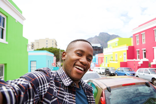 Cheerful young african man taking a selfie