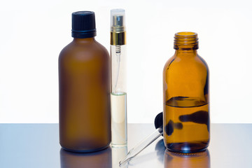 Cosmetic and fragrance glass bottle in white background