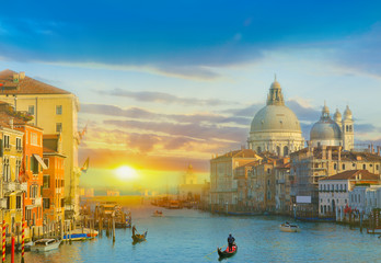 Vibrant sunrise in Venice city among historic architecture illuminated by sunshine