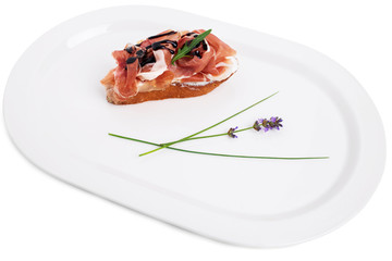 Prosciutto bruschetta with ricotta and arugula.
