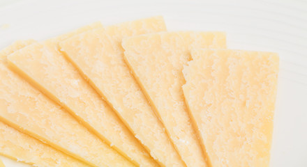 Closeup of delicious sliced parmesan cheese.